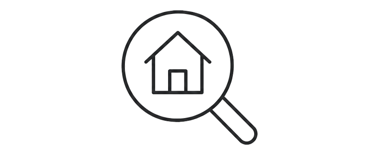 Magnifying glass focusing on a house icon.