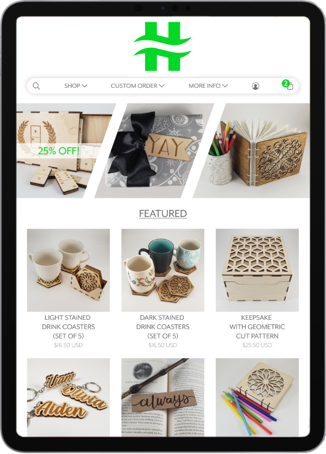 Mobile device screen displaying online shop webpage displaying wooden crafts, drink coasters, a keepsake box, and personalized keychains.