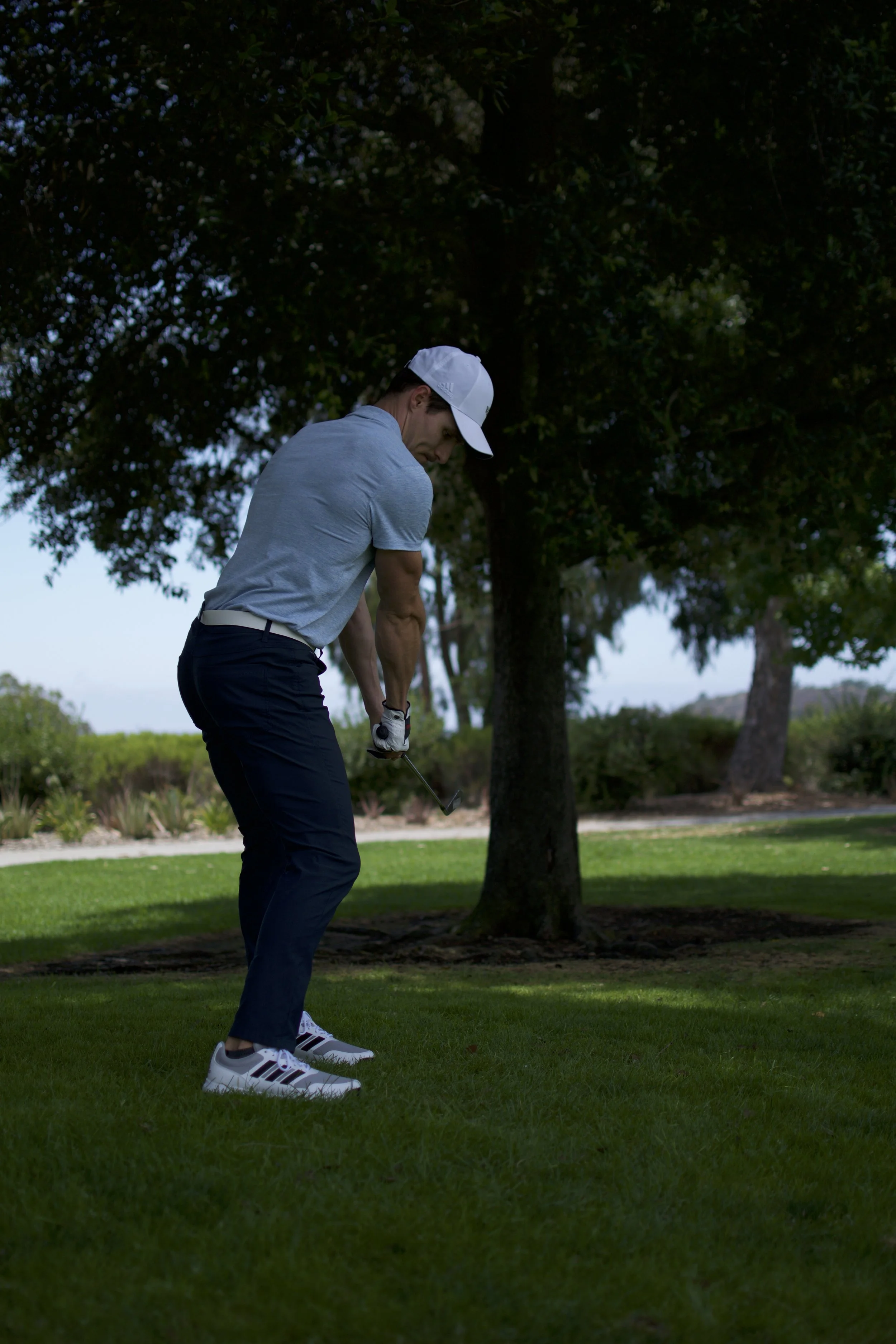 golfer hitting out of rough