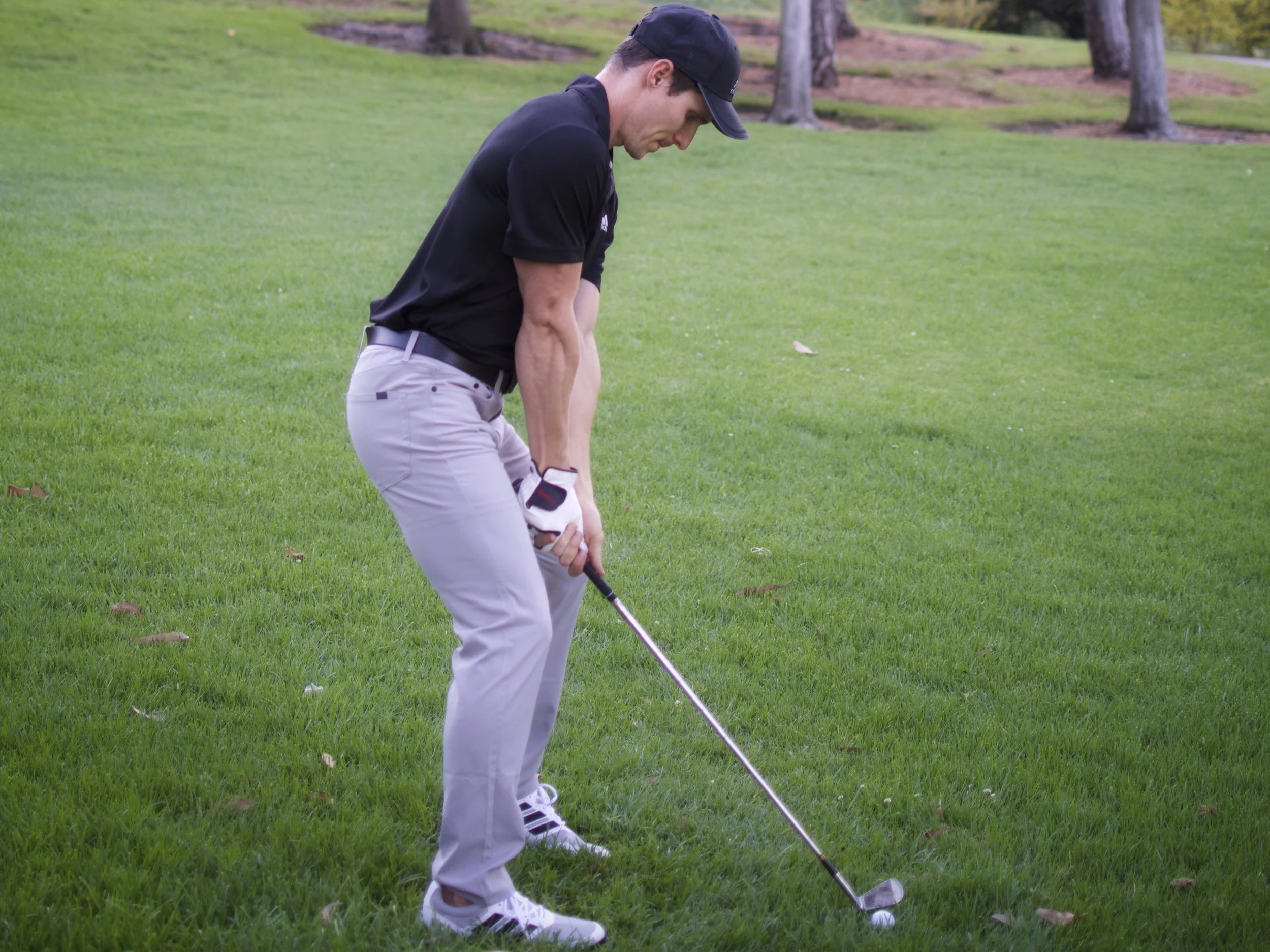 golfer practicing wedge shot