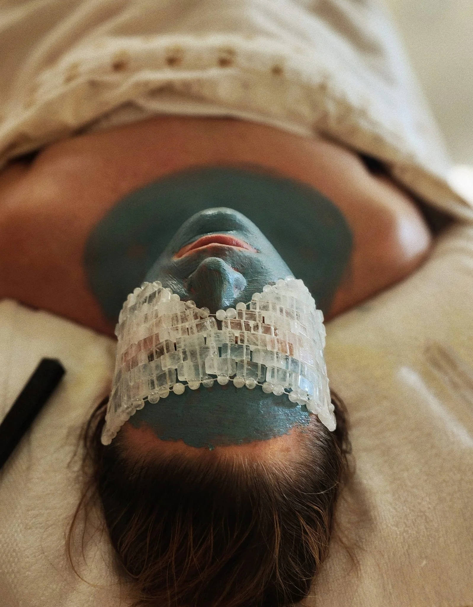 Plant-Based Natural Holistic Skin Facial Specialist - Client picture is receiving a Ritual for the Wise Skin treatment at Dahlia Beauty Bar, anti-aging treatment for aging concerns.