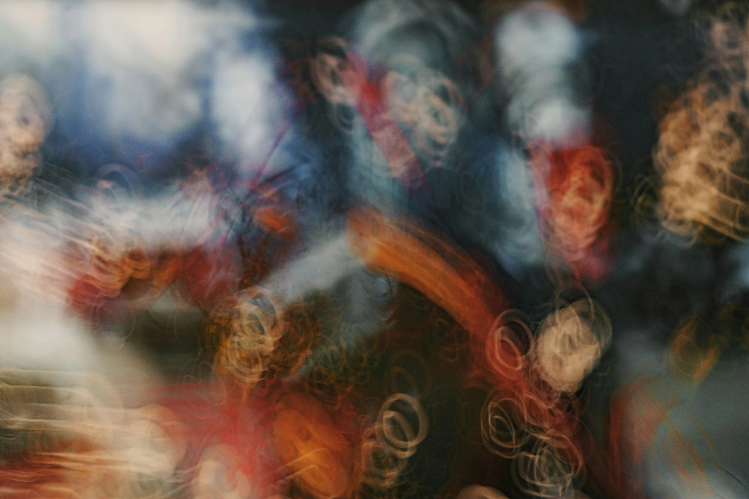 Abstract blurred image of city lights creating colorful bokeh effects.