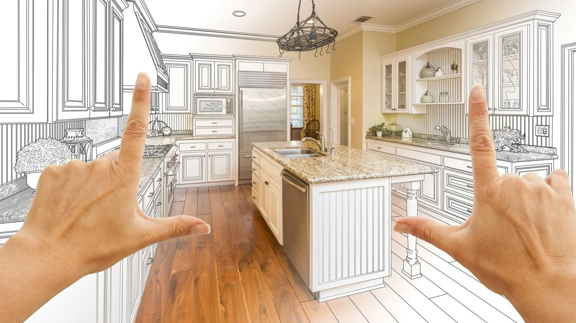 A kitchen with partially sketched cabinetry, countertops, and backsplash, with hands pointing at the drawing. The kitchen has wooden floors, a central island with a granite countertop, and stainless steel appliances.