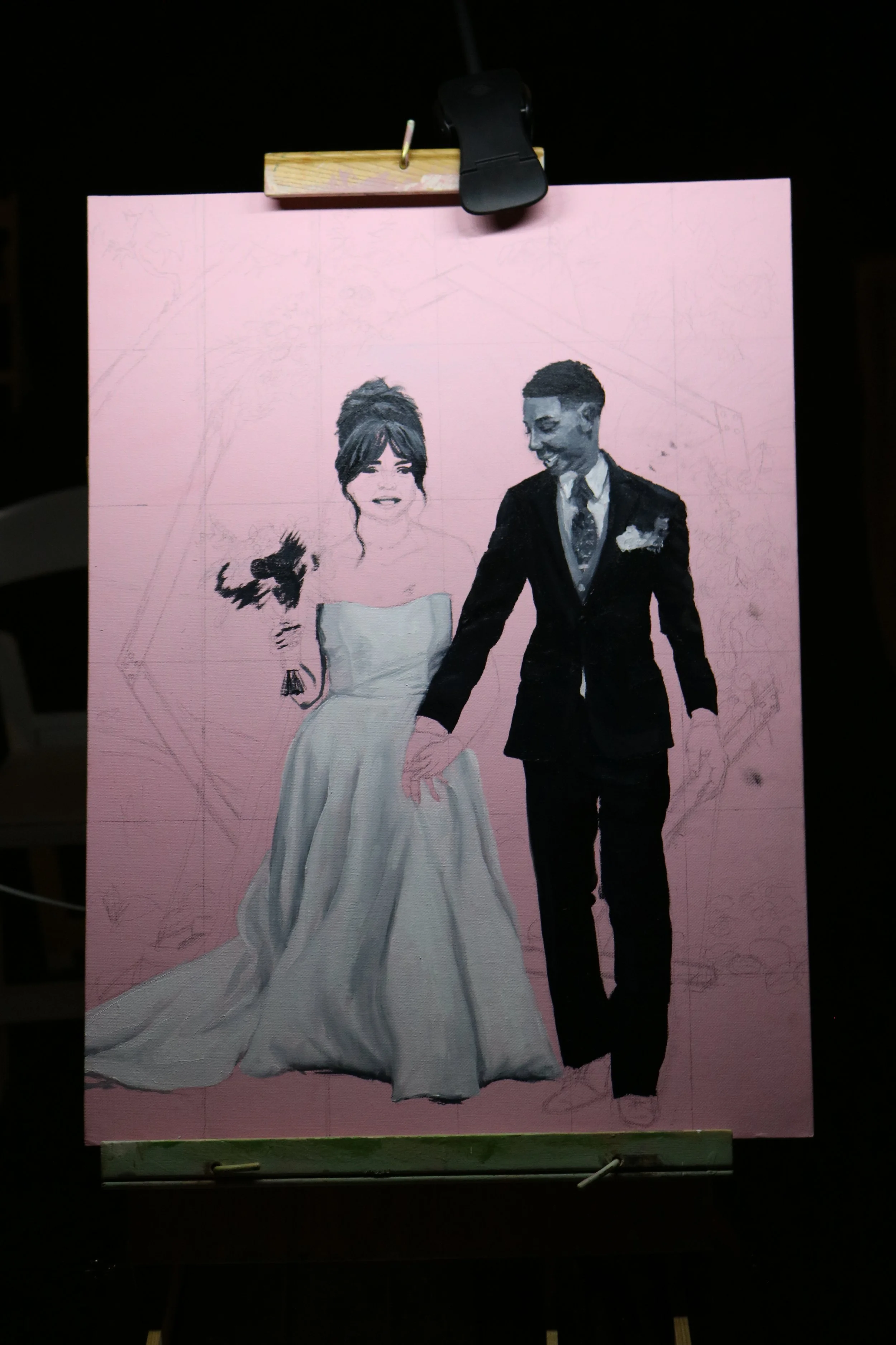 A work-in-progress painting of a bride and groom dressed in wedding attire, holding hands on a pink background, with the figures partially outlined.