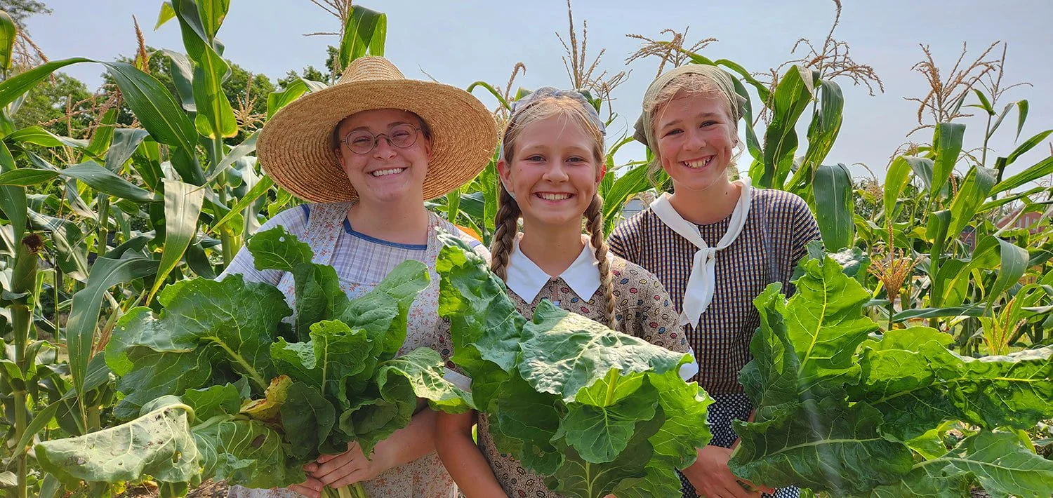 Girls in the vegetable garden at Shawnee Town