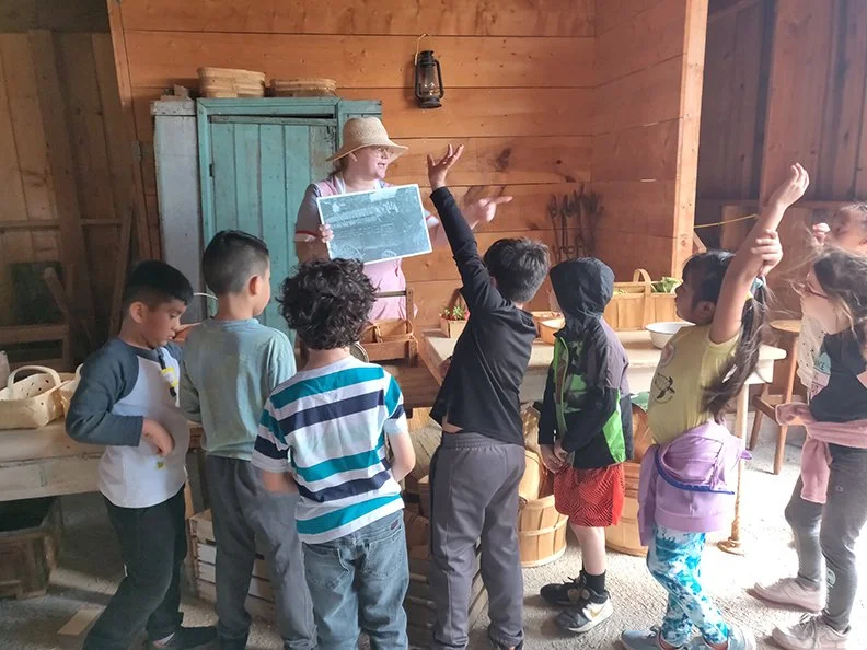 A volunteer works with a class at Shawnee Town