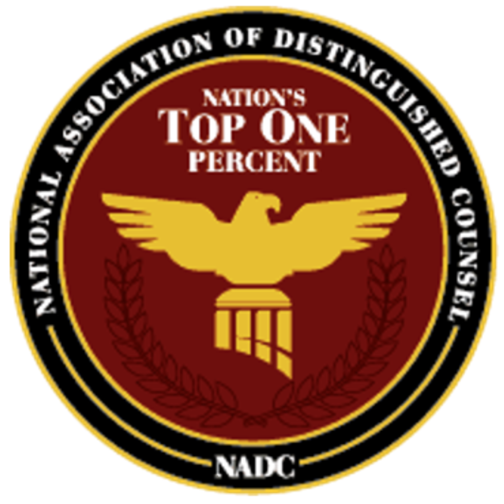 Emblem with a top view of a bald eagle with outstretched wings perched on a shield, surrounded by a laurel wreath, with text indicating it is a recognition badge from the National Association of Detectives.