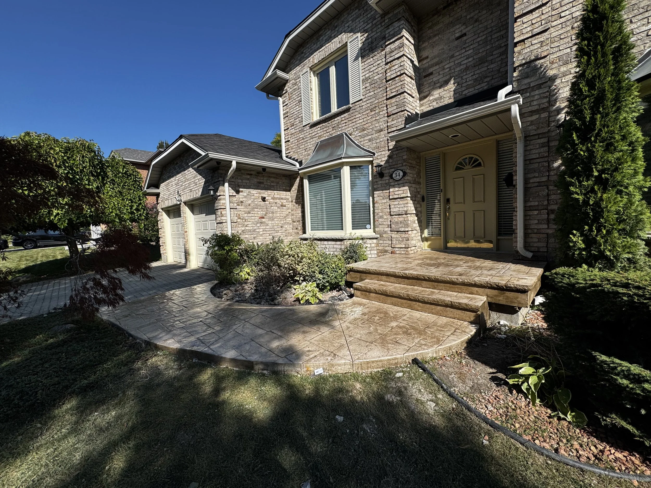 Newly poured stamped concrete entranceway 