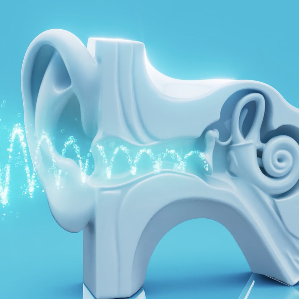 A white model of a human ear with water splashing inside, against a blue background.