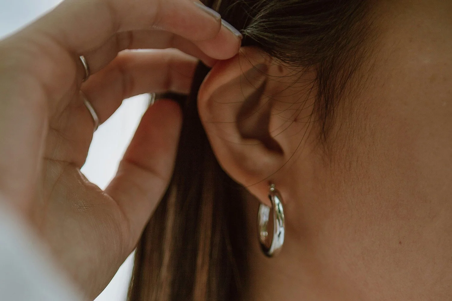 tinnitus misconceptions - woman's ear