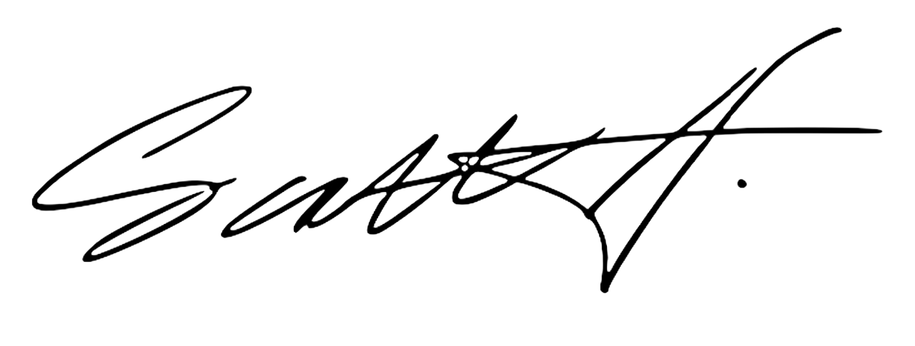 Black cursive signature on a white background.