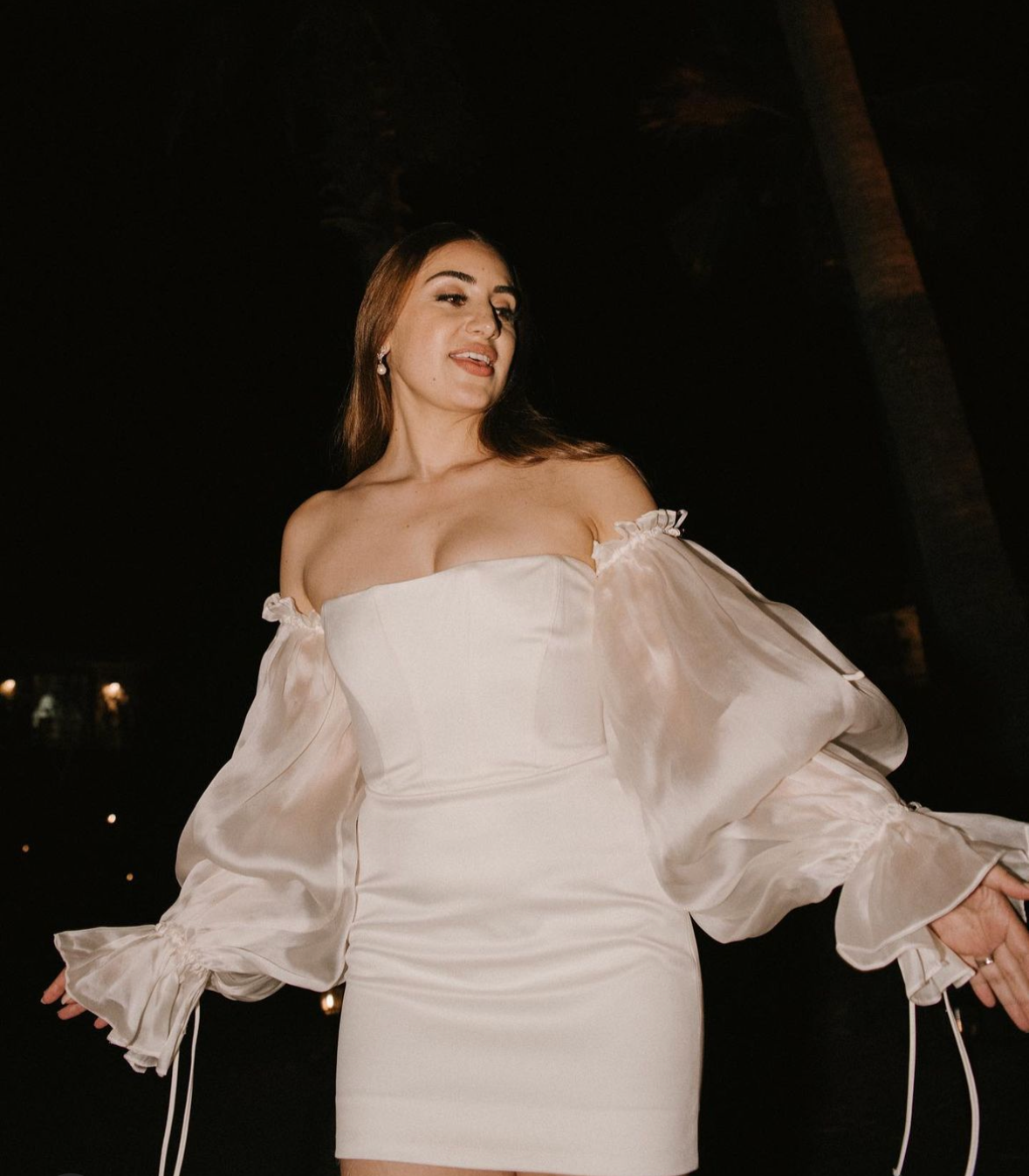 Bride with flawless, long-lasting bridal makeup captured at night, glowing with confidence and polished, camera-ready beauty