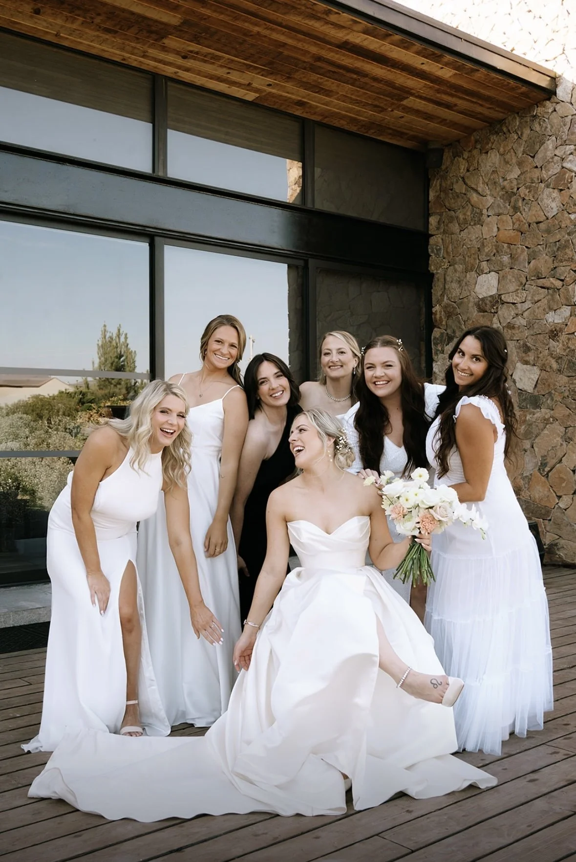 Bride and bridal party with cohesive, polished hair and makeup, looking confident, radiant, and beautifully styled for a seamless wedding day experience