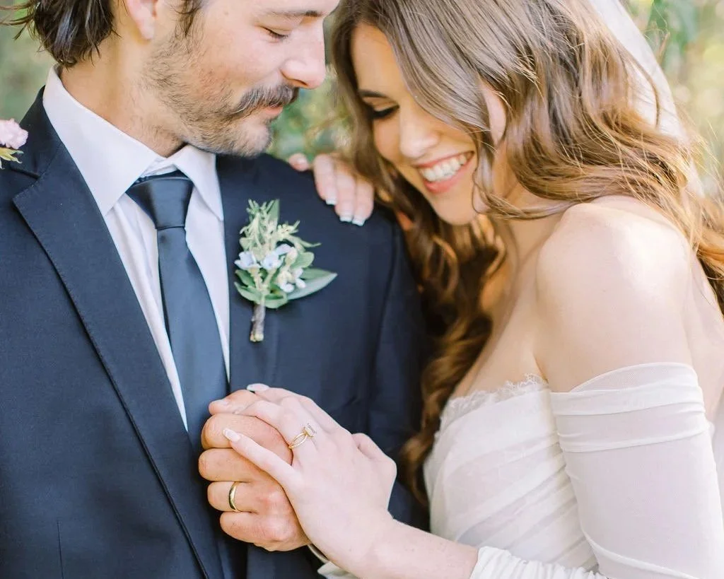 Bride with natural glam makeup and soft bridal hairstyle during outdoor wedding in Southern California