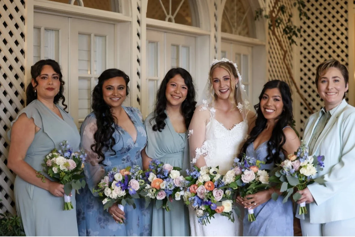 Bride and bridal party with cohesive, polished hair and makeup, looking radiant, confident, and beautifully styled for a seamless wedding day experience