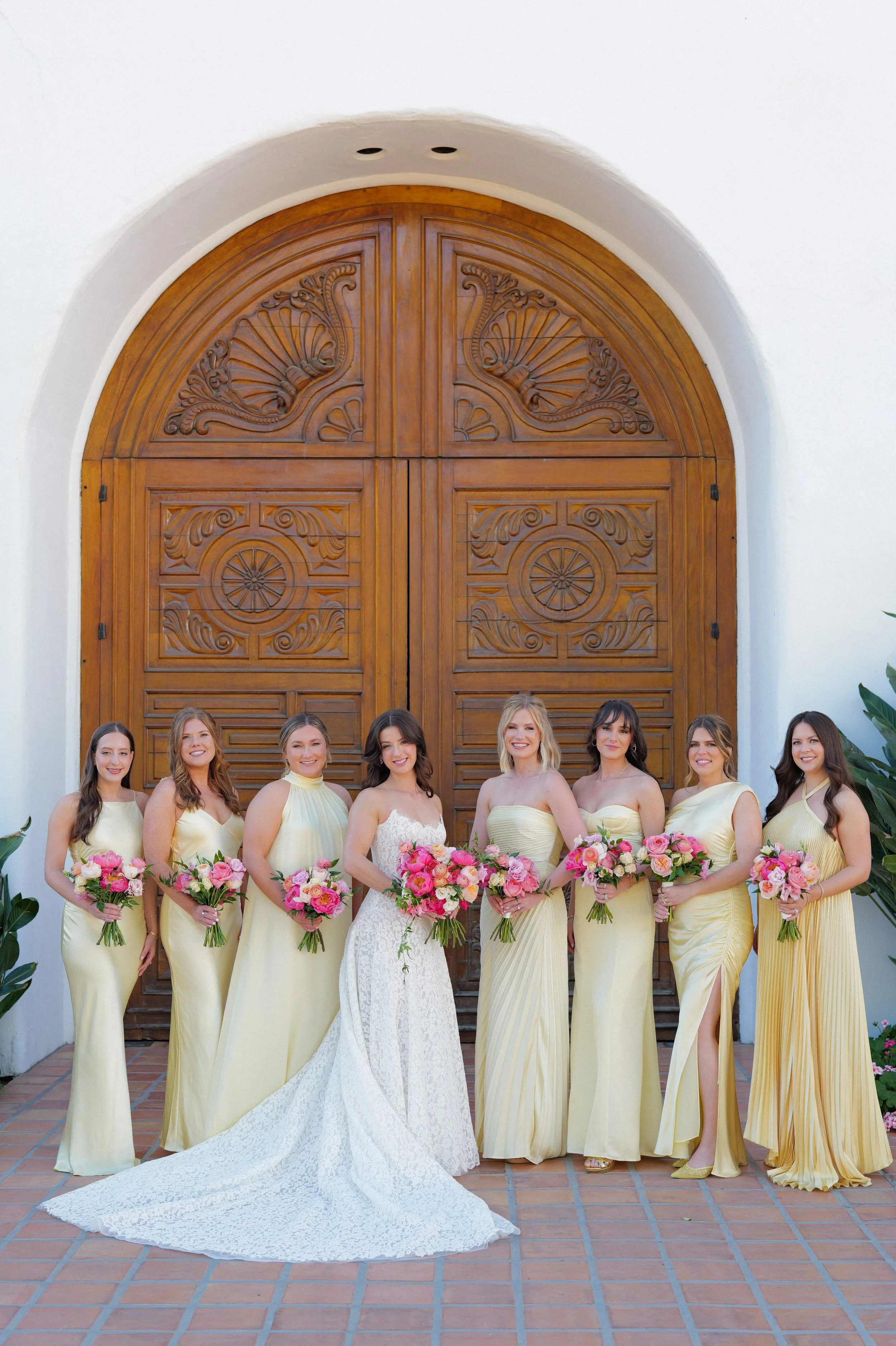 Bride and bridal party with cohesive, soft glam hair and makeup looking confident and polished before the ceremony