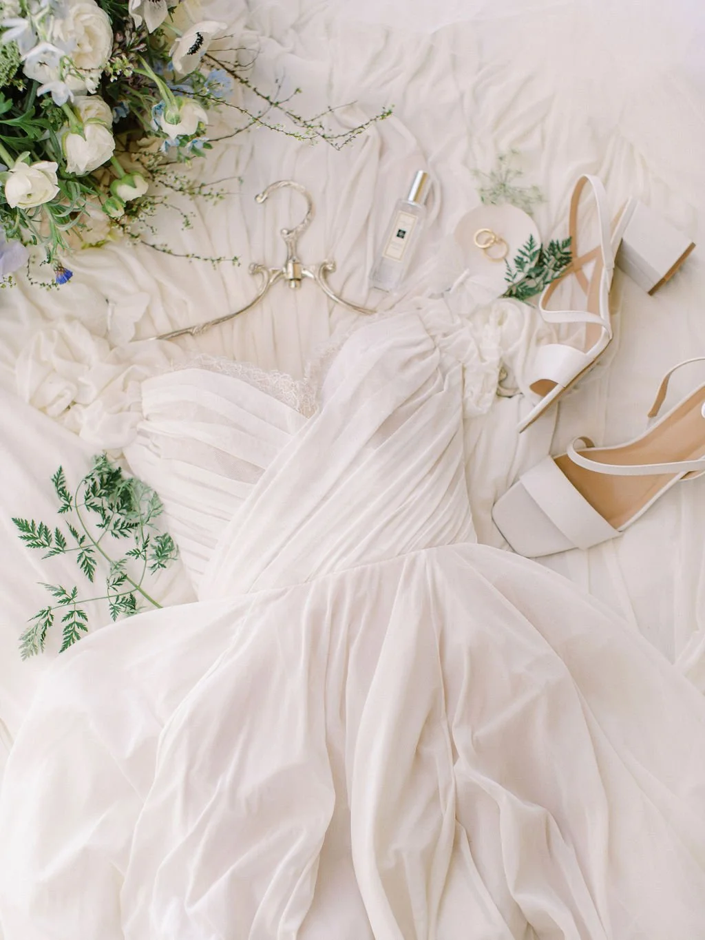 Bridal details including wedding dress, heels, and accessories styled for an elegant, luxury wedding morning