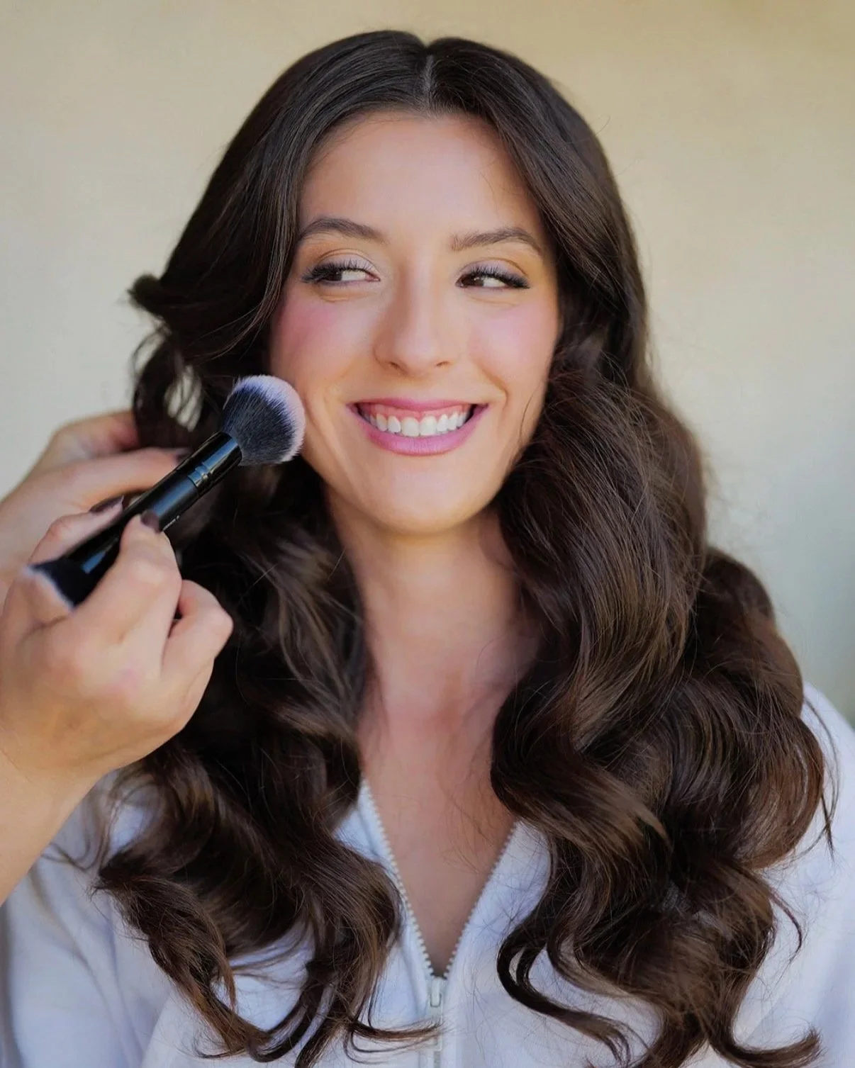 Natural glam bridal makeup application with soft waves, creating an elevated and timeless wedding look