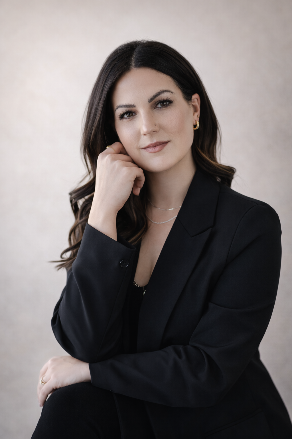 Bridal hair and makeup artist portrait showcasing modern, elevated beauty and a calm, refined aesthetic