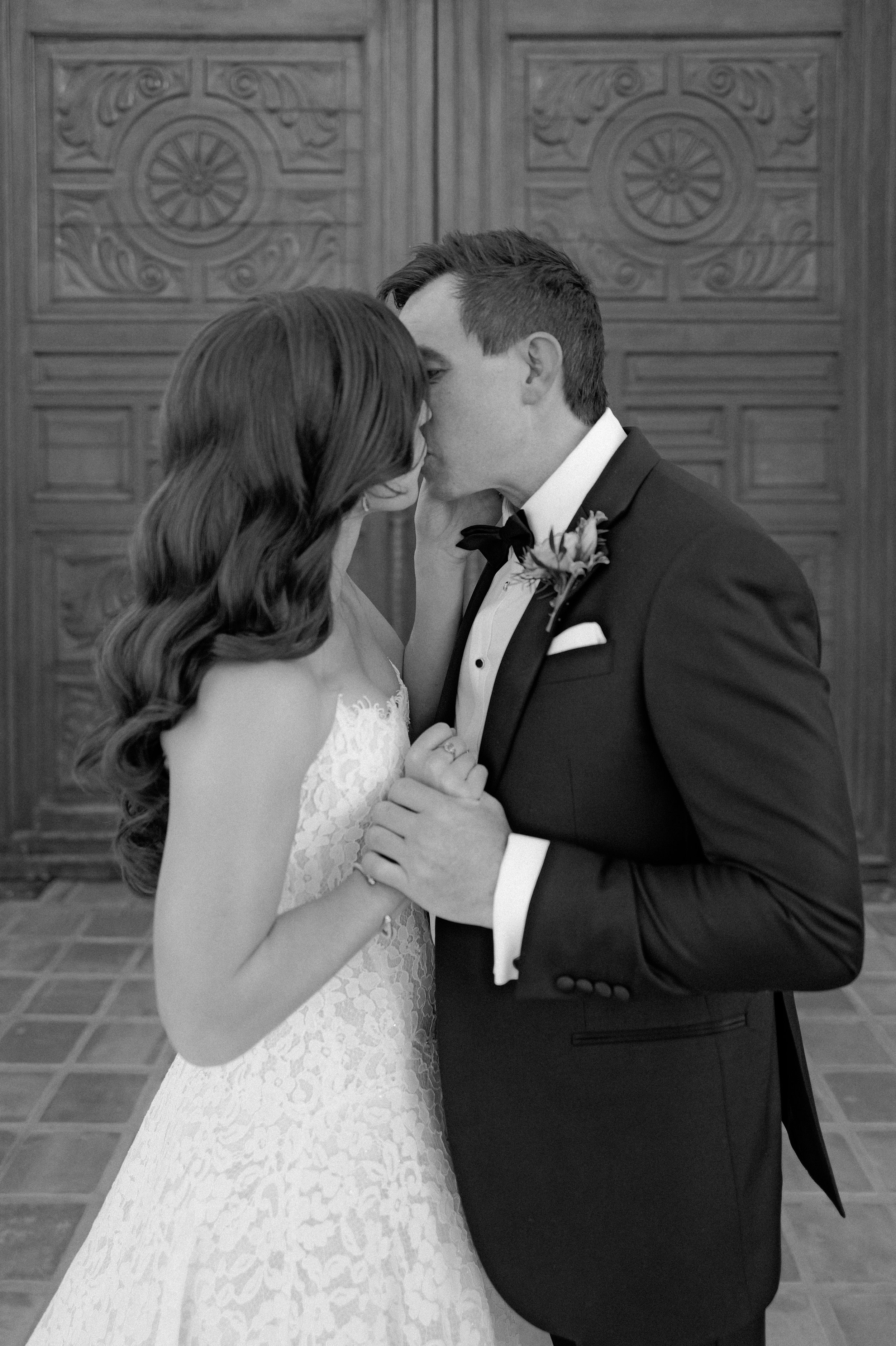 Bride with timeless, natural bridal makeup sharing a romantic ceremony moment, looking radiant and effortlessly beautiful