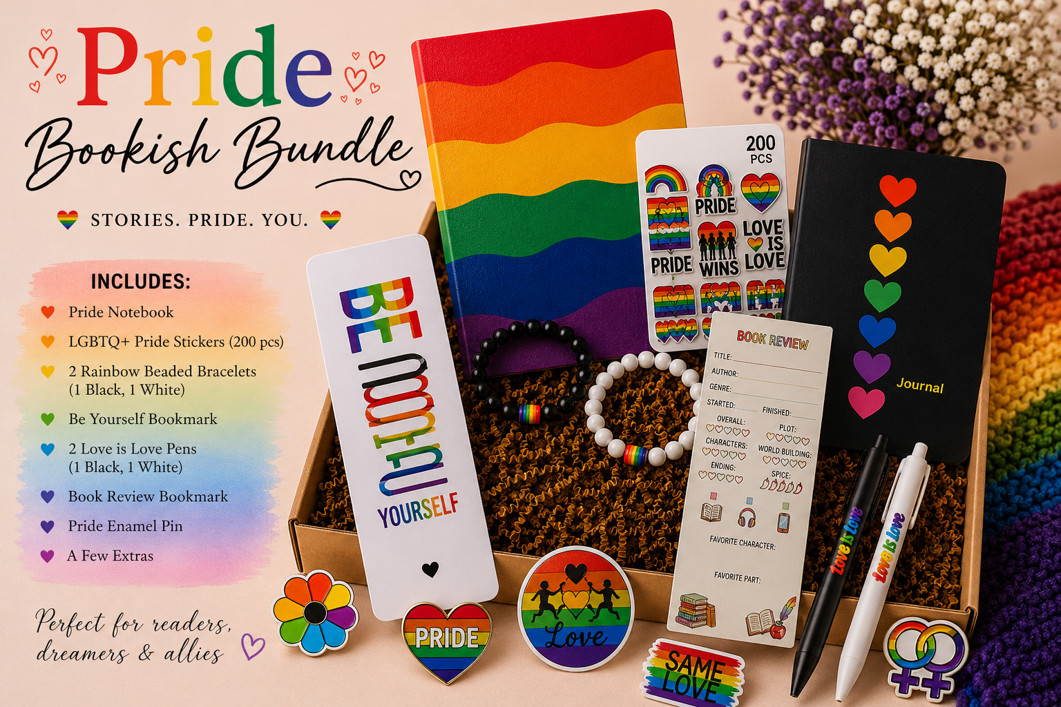 Pride Bookish Bundle with rainbow-themed stationery and accessories, including a pride notebook, LGBTQ+ pride stickers, beaded bracelets, book review bookmark, pride enamel pin, pens, and pride-themed buttons, arranged in a box with a rainbow backgro