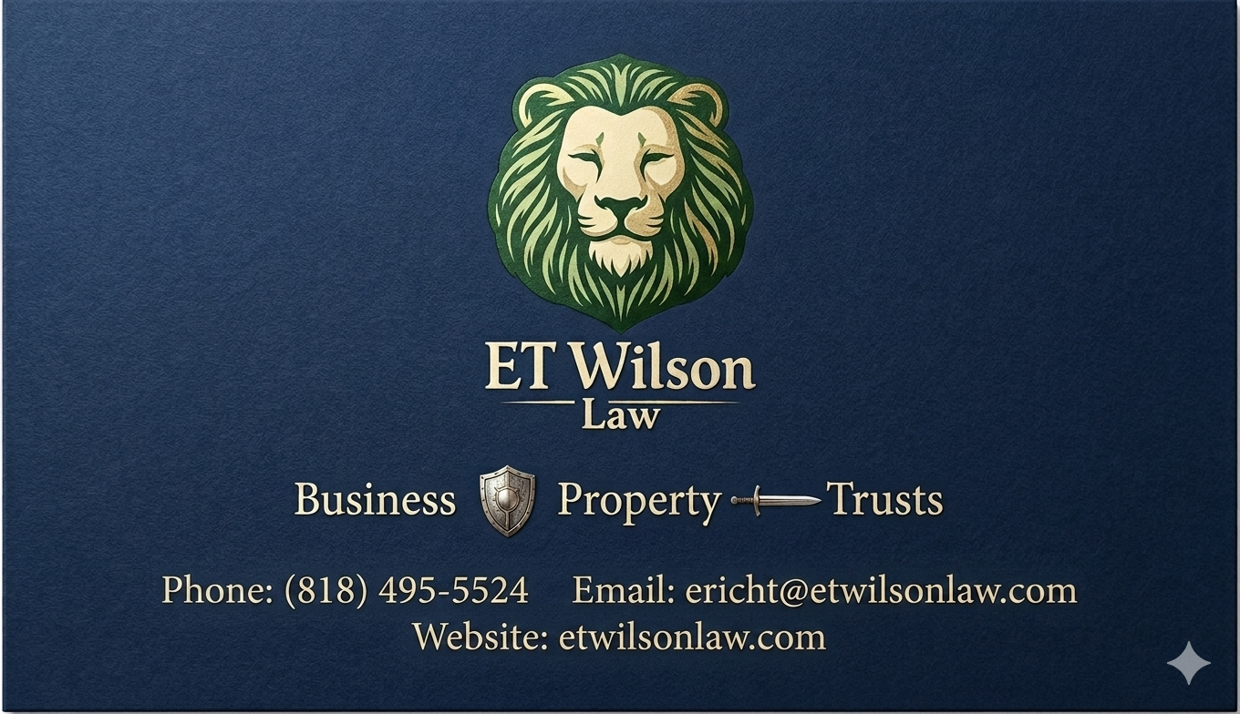 Business card for ET Wilson Law featuring a lion logo, with services in Business, Property, and Trusts, contact phone number, email, and website.