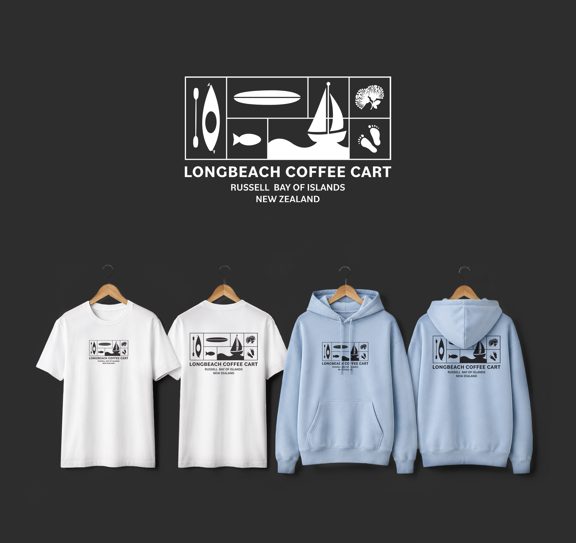 Display of four t-shirts hanging on wooden hangers against a dark wall, each with a logo and text promoting Longbeach Coffee Cart in Russell Bay of Islands, New Zealand.
