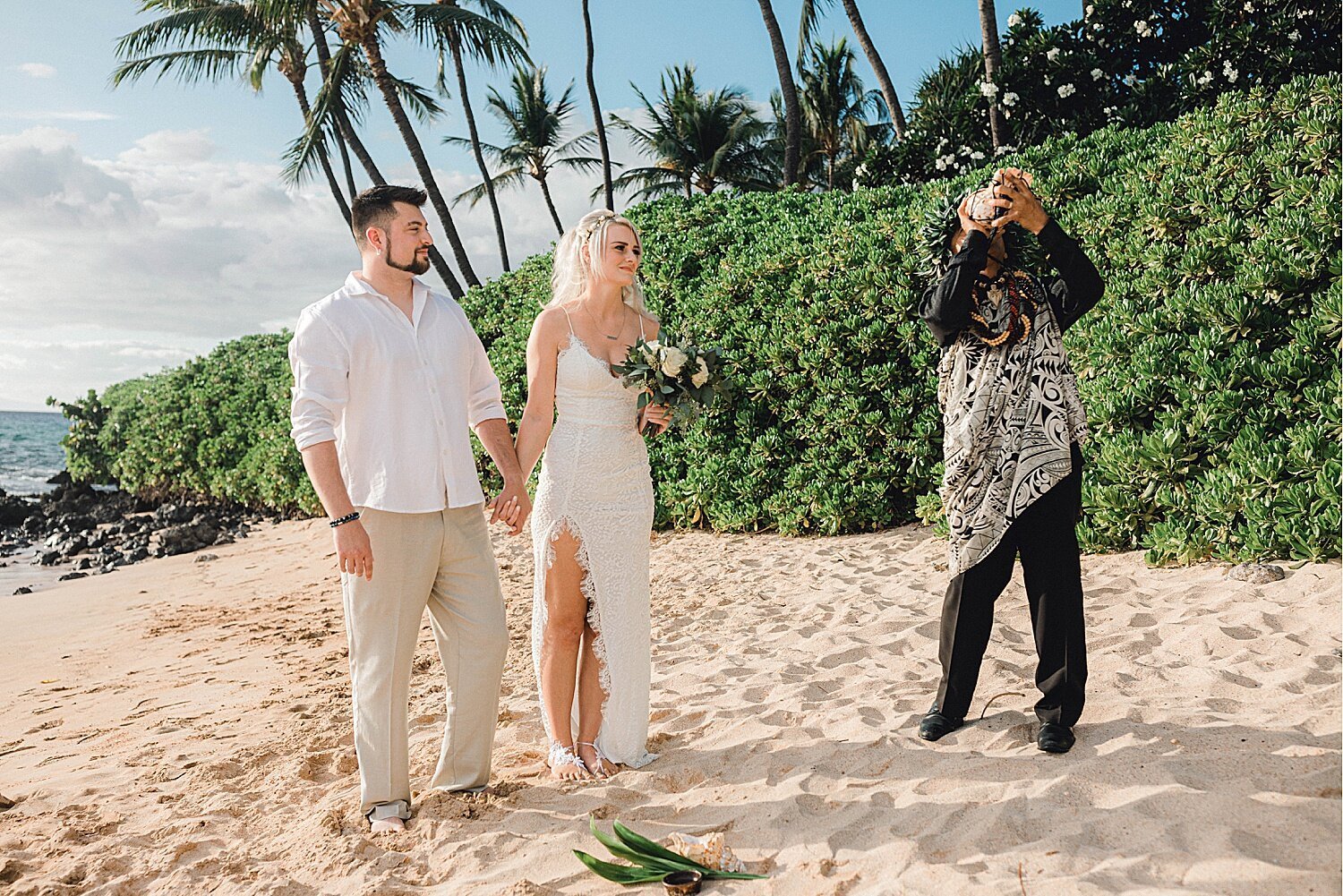 Blowing of the Pu, Hawaiian conch shell, during a Maui beach elopement
