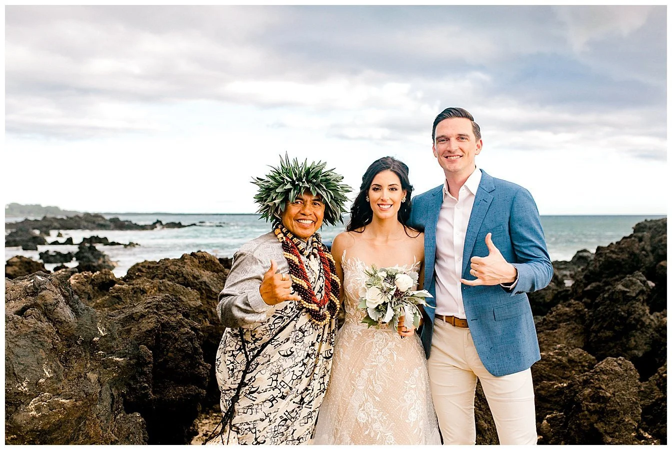 Bride, groom, and officiant giving the shaka following a Maui elopement ceremony
