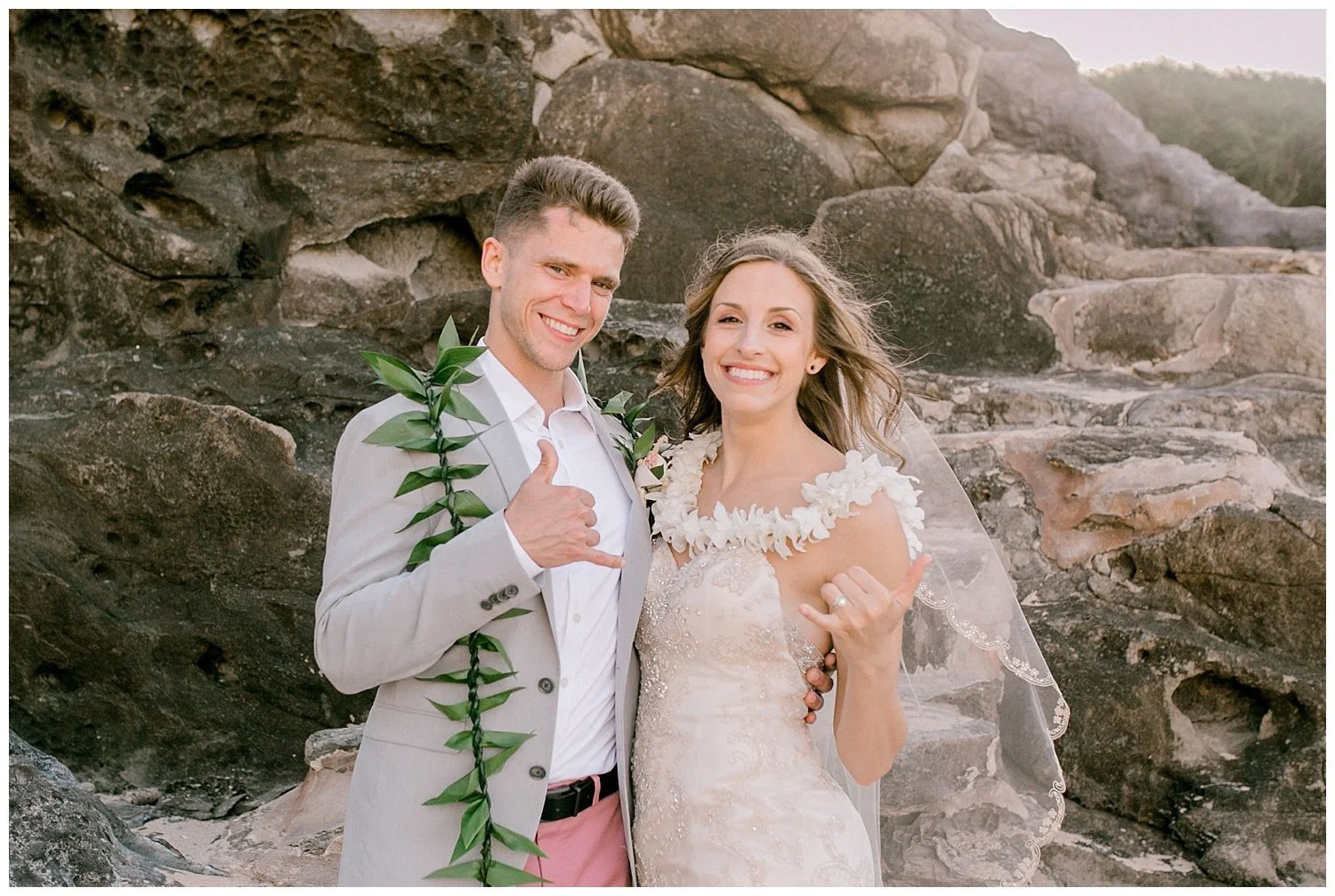 Bride and groom giving shaka after Maui wedding
