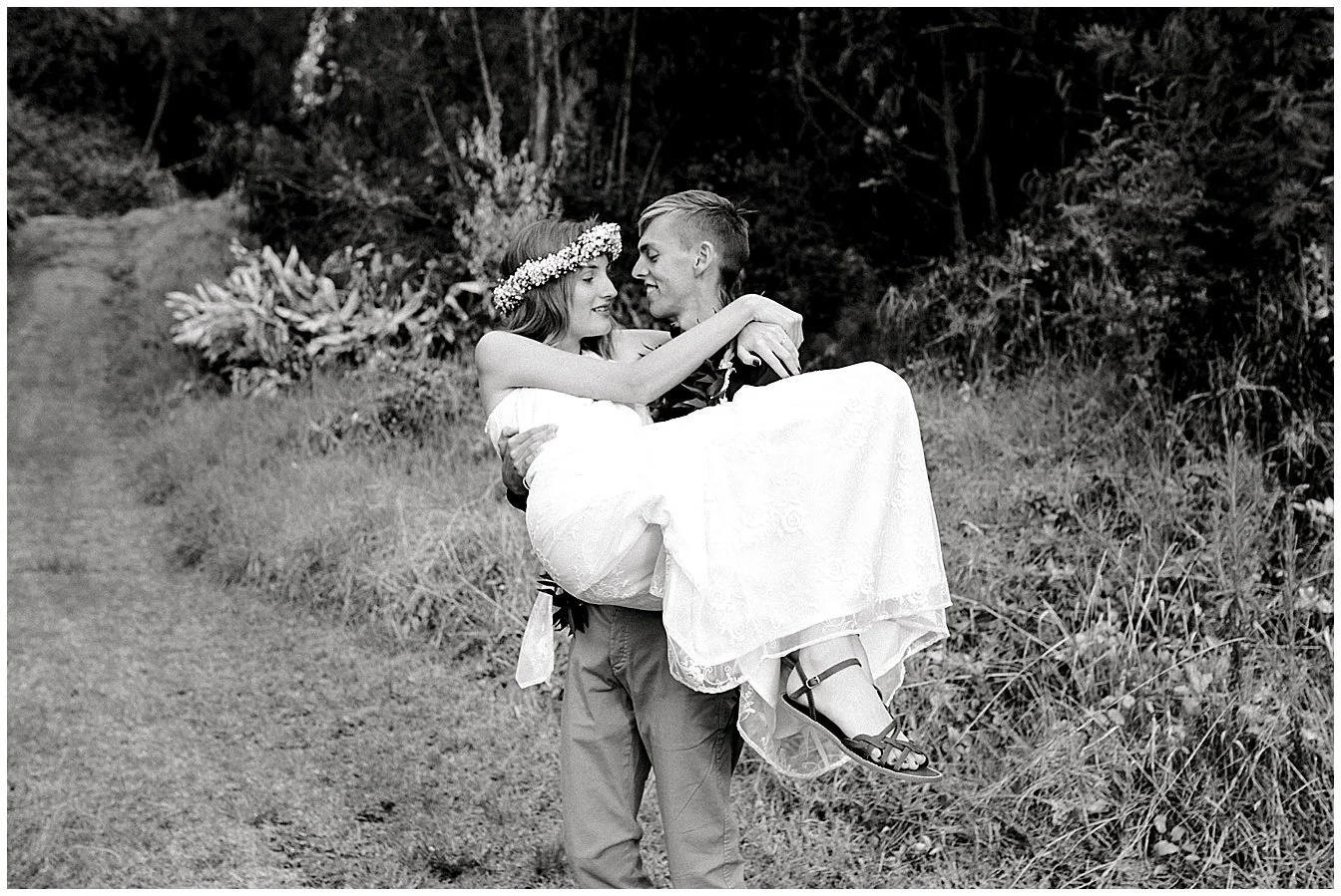Maui groom carrying bride
