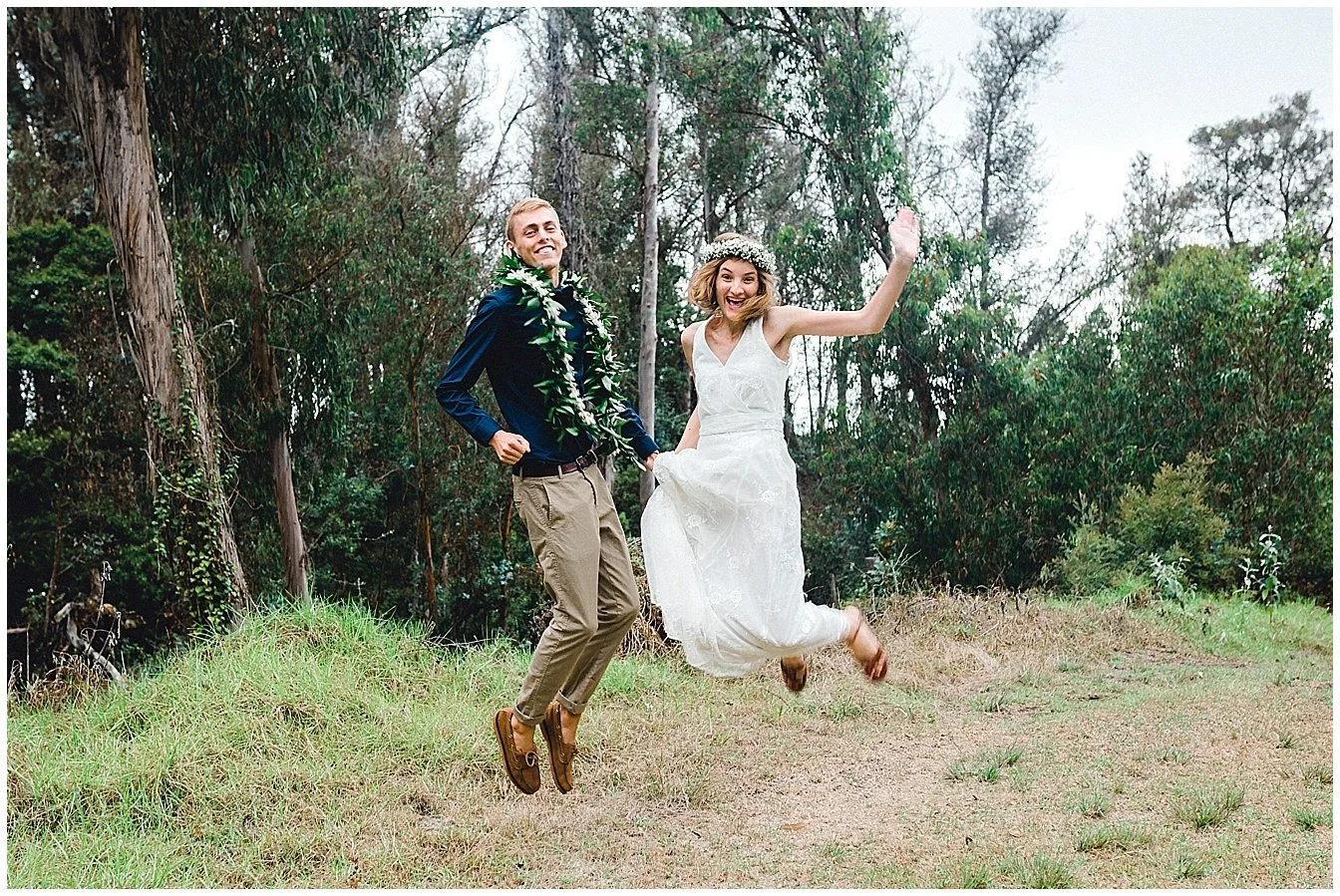 Maui bride and groom jumping for joy