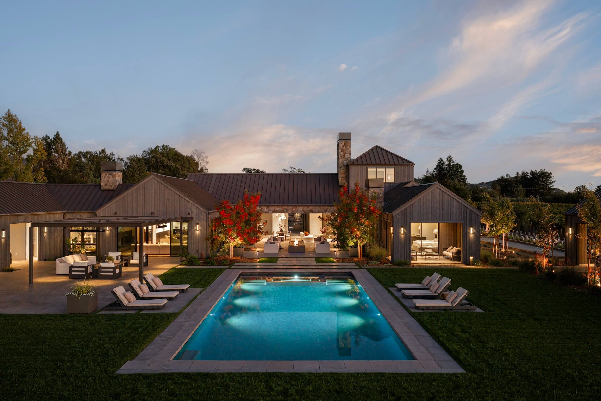 Dusk-to-dawn patio lighting and pool integration in Napa Valley, showcasing the balance between warm interior architectural light and exterior LED scenes.