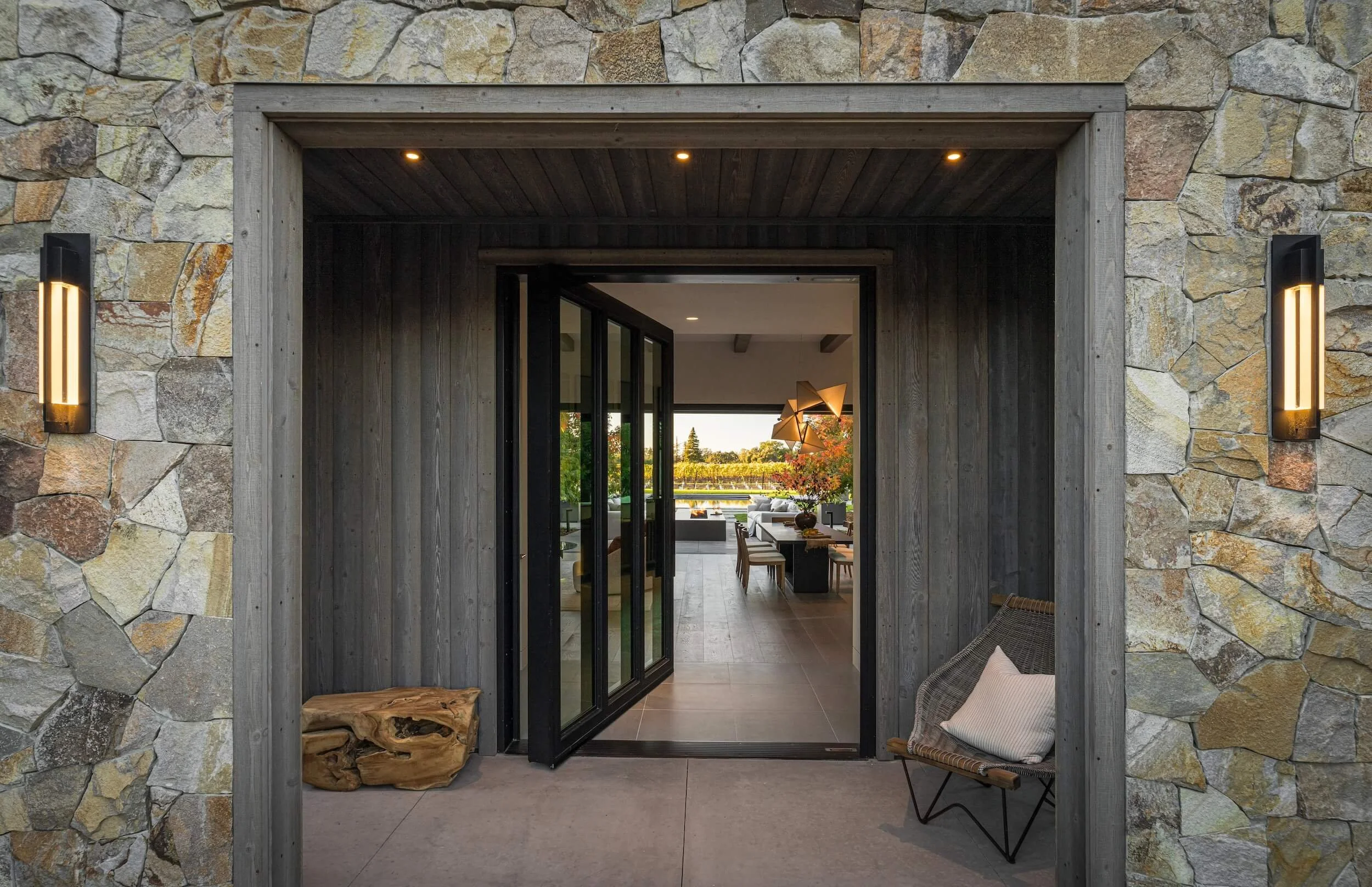 Warm entry lighting highlights the clean lines of the McKinley Compound, a luxury home in Napa Valley with custom electrical design.