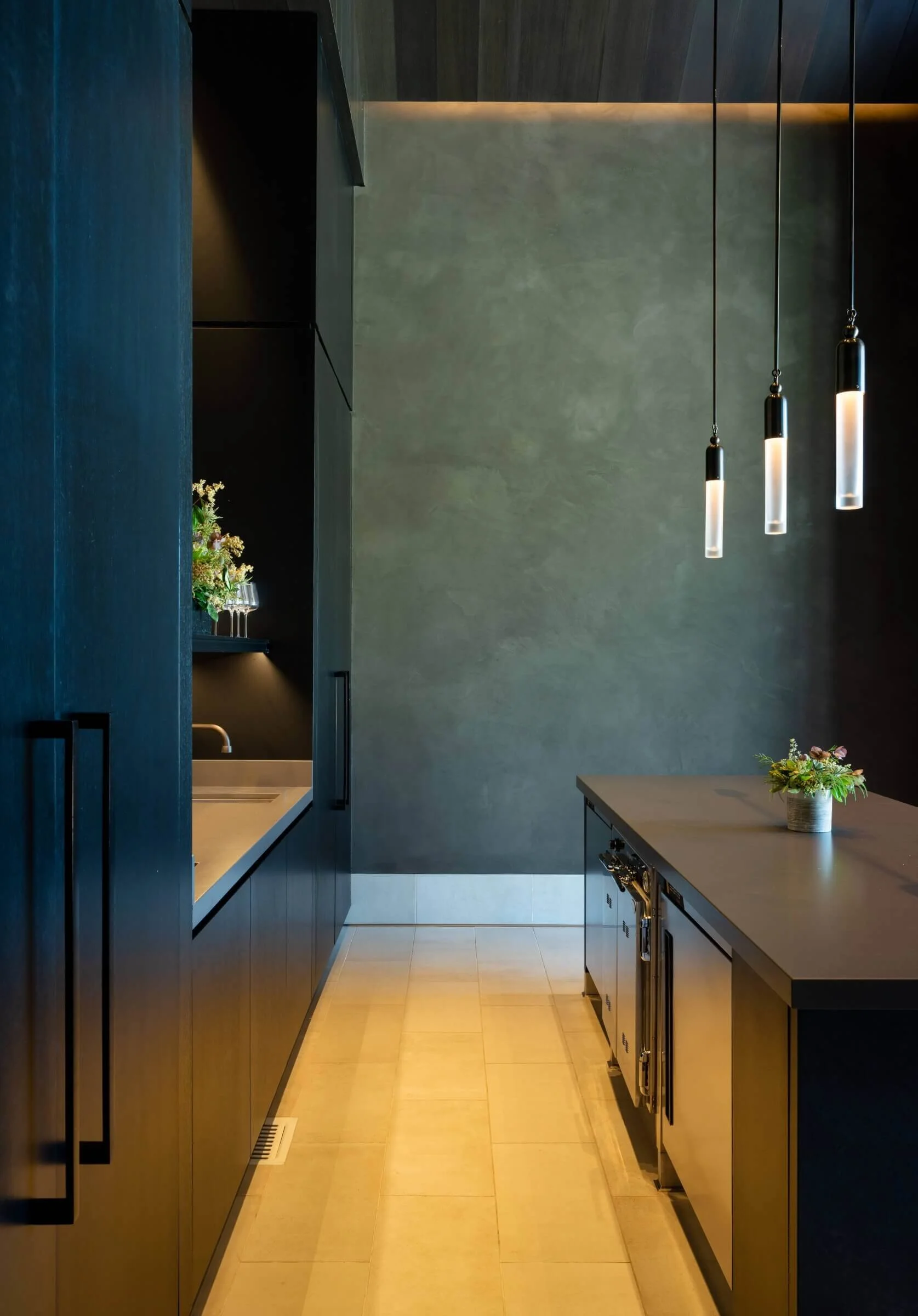 Interior walkway of a Mount Veeder winery featuring dark premium finishes, custom integration for linear path lighting, and automated lighting scenes for the hospitality space.
