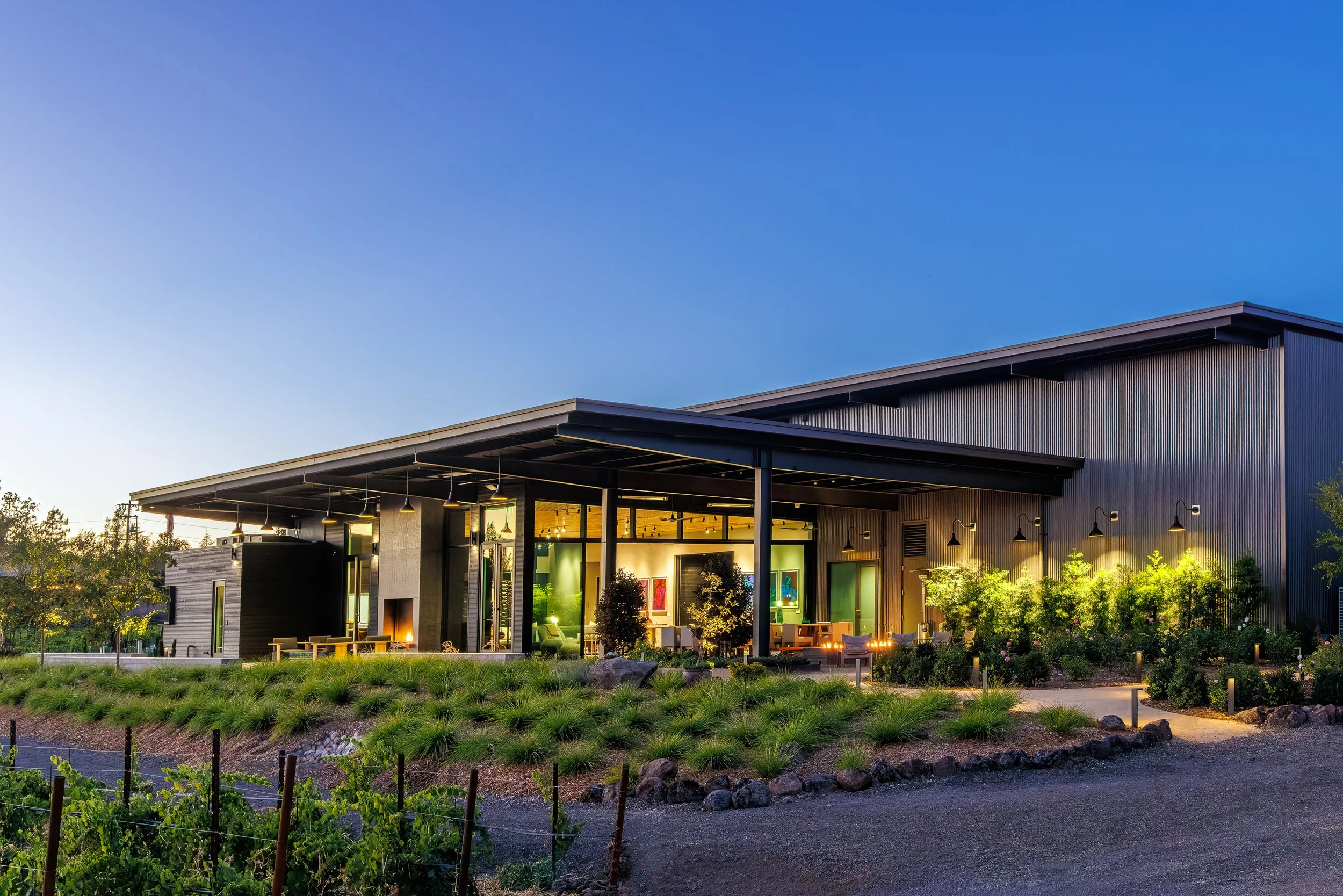Exterior and landscape lighting bring the clean architectural lines of Ellman Winery into focus while maintaining a warm presence across the property.