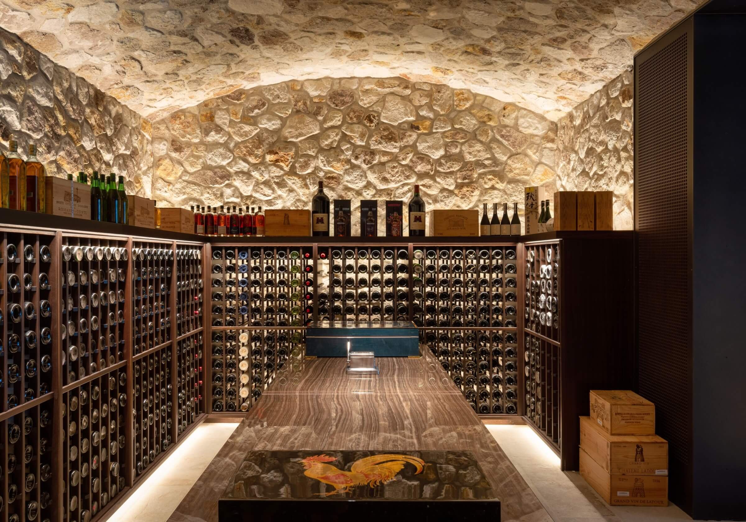 Architectural lighting in the historic 1889 stone winery, featuring specialized low-heat LED integration for barrel cellar preservation.