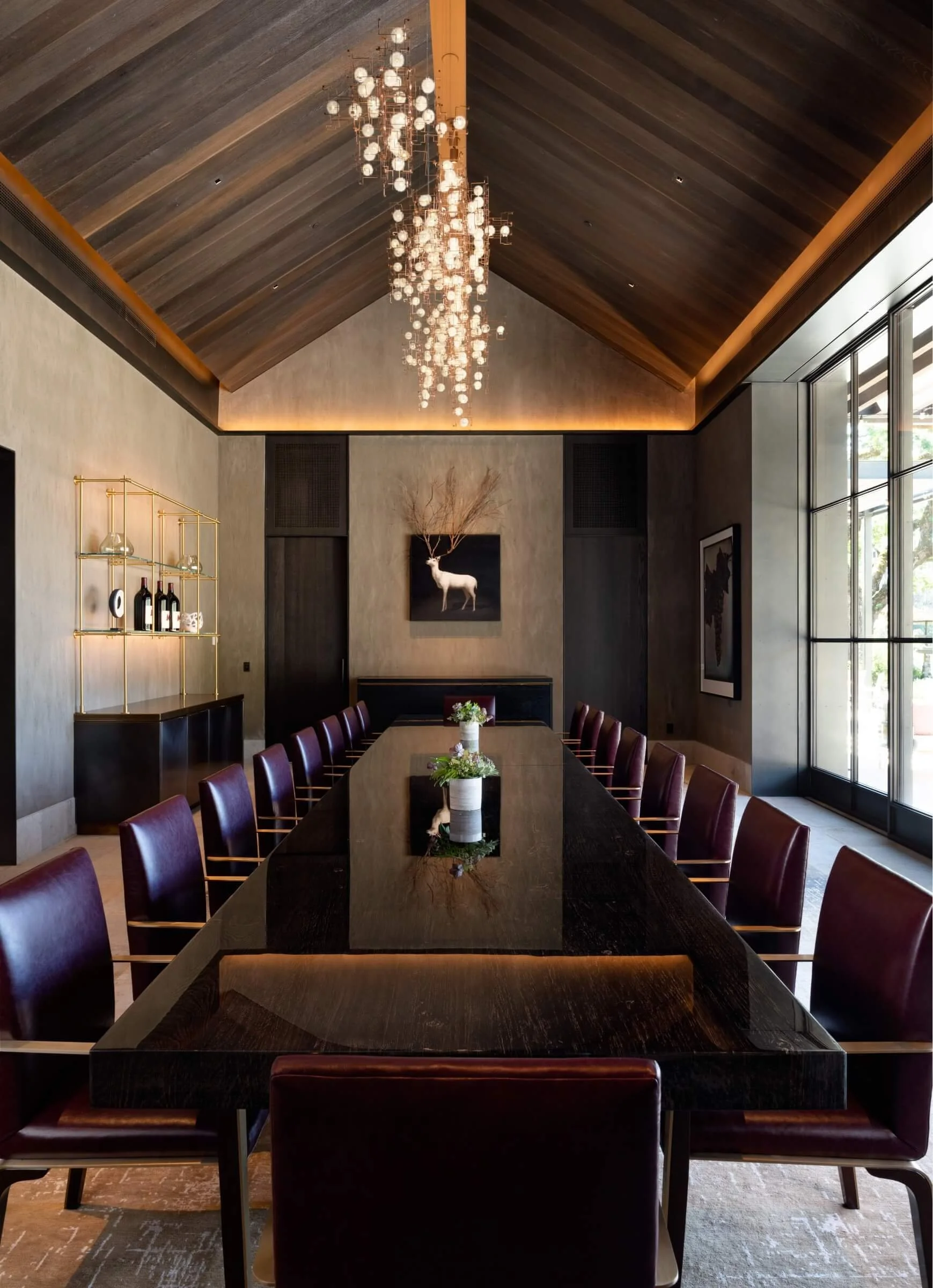 Lighting design for the Mayacamas grand tasting room, featuring a custom modern chandelier and integrated LEDs over the 24-foot gathering table.