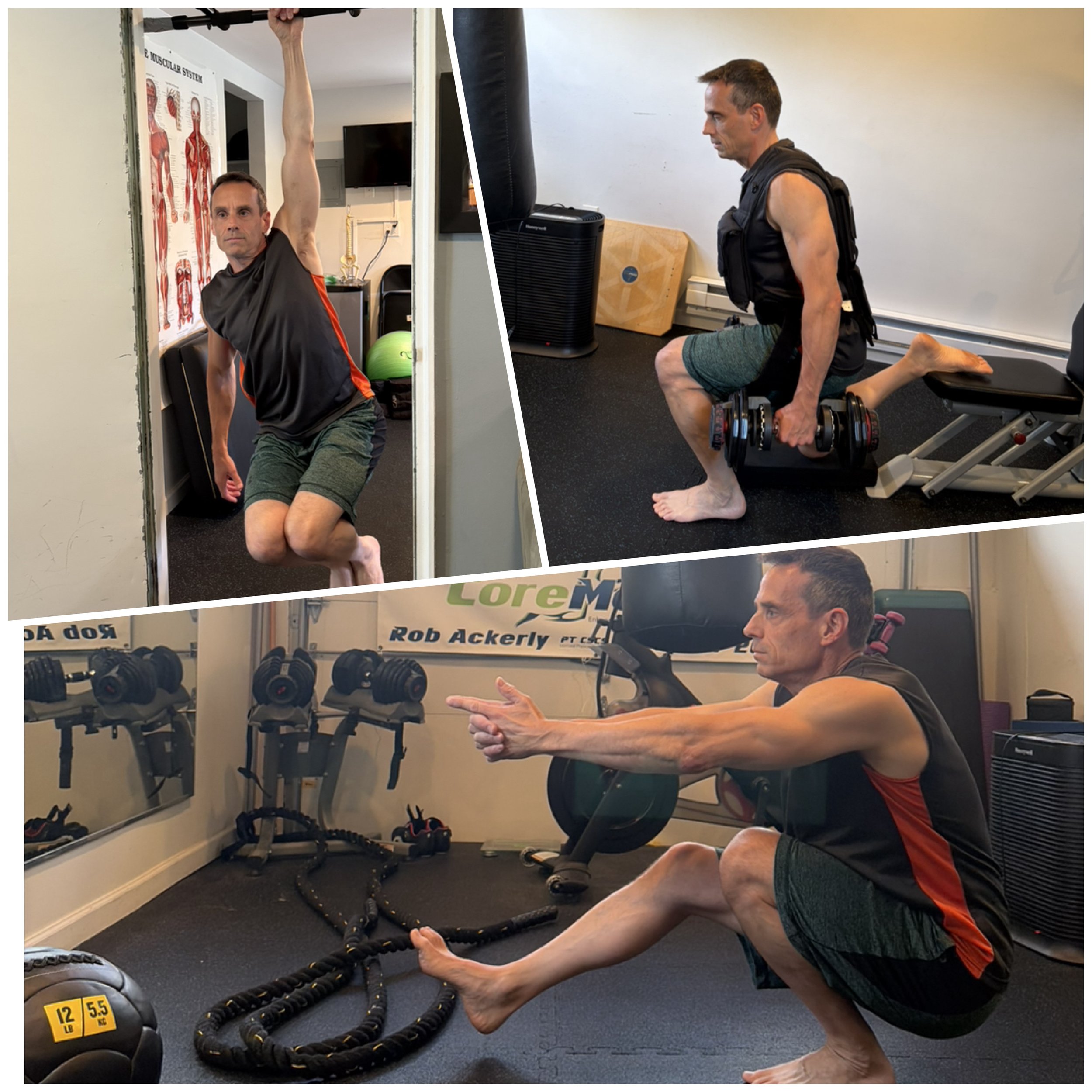 A man in workout clothes is doing a stretching exercise in a home gym. He is in a kneeling position with one arm extended forward and the other arm holding a dumbbell. The gym has various equipment including kettlebells, battle ropes, and a poster of the muscular system on the wall.