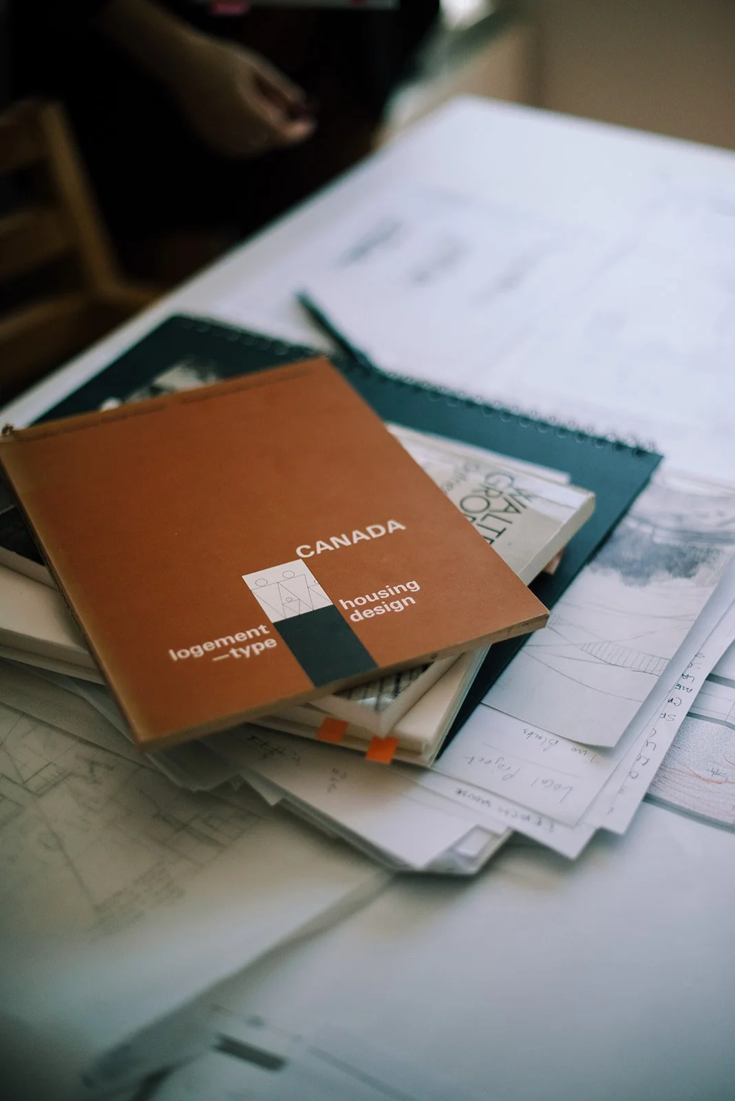 Canadian Housing Design book, on table in poliarchitecture office.
