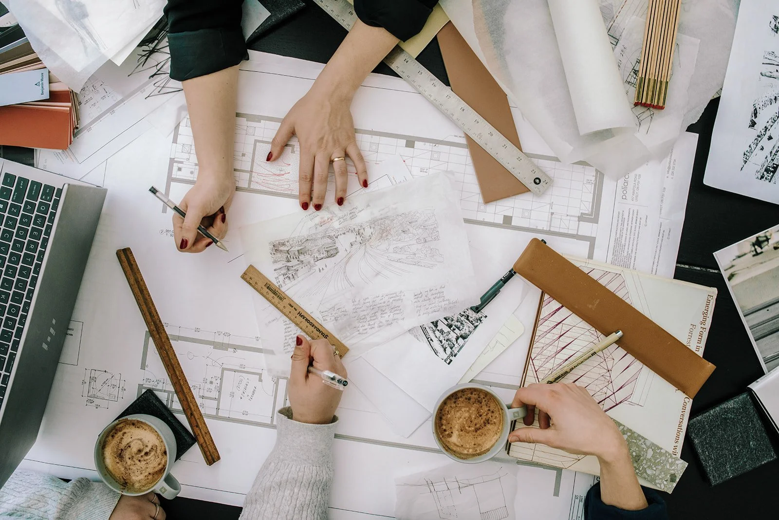 Image by Flo Foto Sudbury of poliarchitecture office working on sketches for custom design and build projects in Sudbury and Northern Ontario.