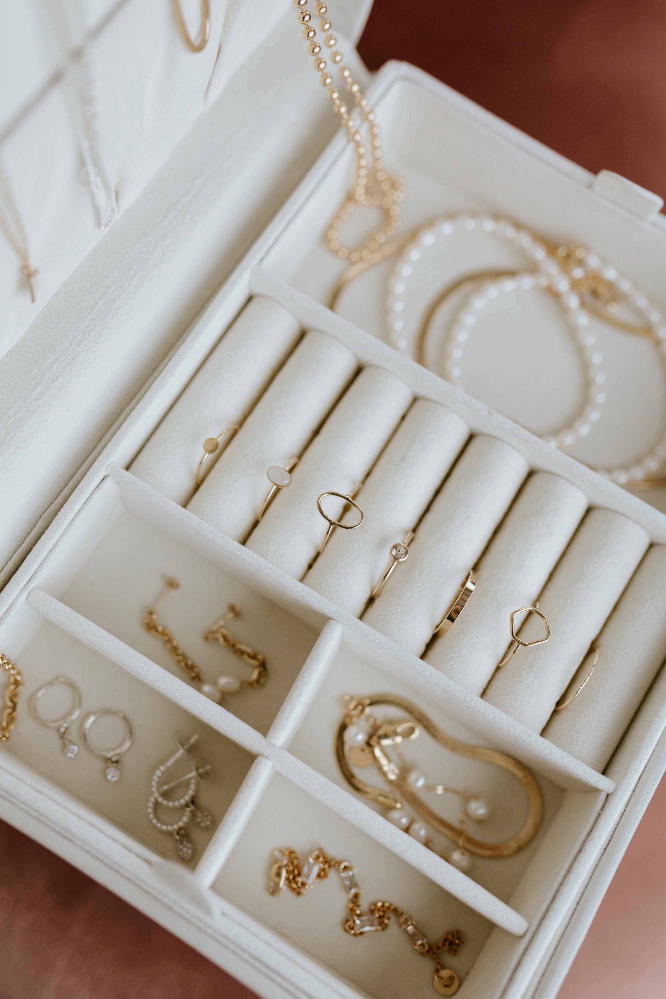 A jewelry box filled with Jillian Leigh Jewelry 14kt gold fine jewelry made in Canada