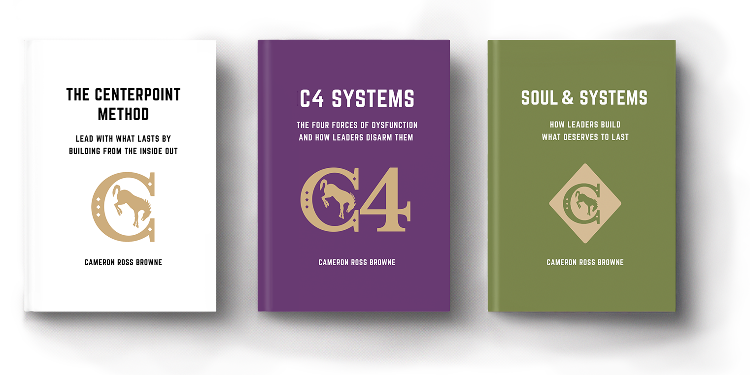 Three books about leadership and systems, titled "The Centerpoint Method," "C4 Systems," and "Soul & Systems," authored by Cameron Ross Browne, displayed on a flat surface.