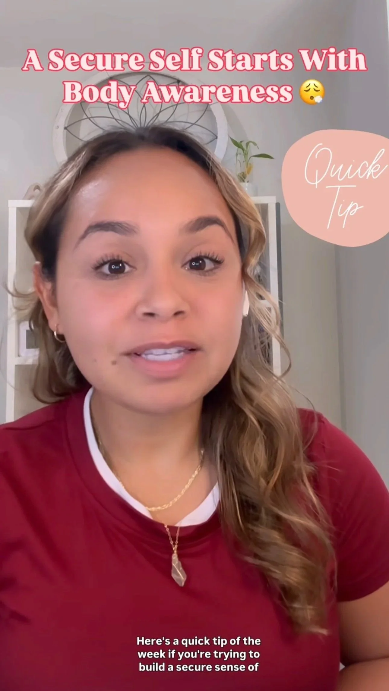 A woman with long, wavy hair wearing a maroon shirt and layered necklaces, speaking in a video with text overlay that says 'A Secure Self Starts With Body Awareness'. There is a pink speech bubble saying 'Quick Tip'.
