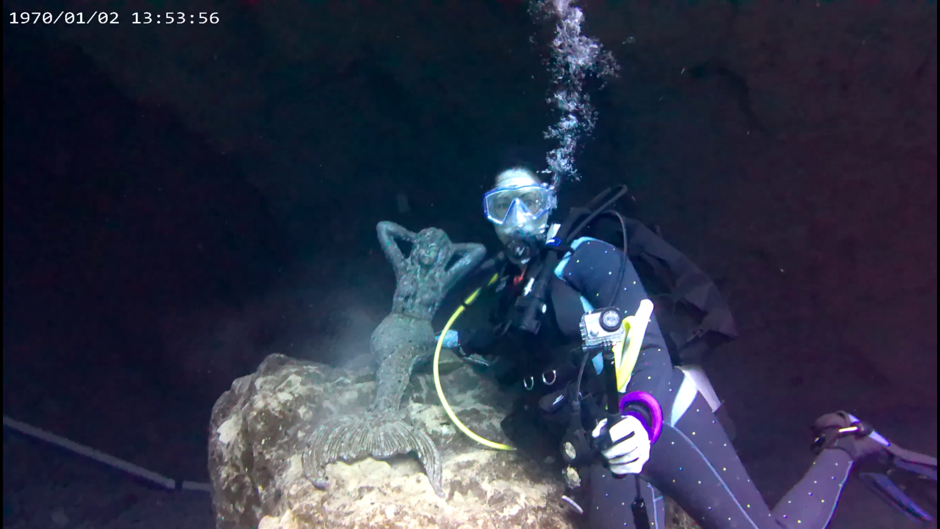 When Lisa isn't a mermaid, she's a scuba diver. Posing here with the local mermaid.