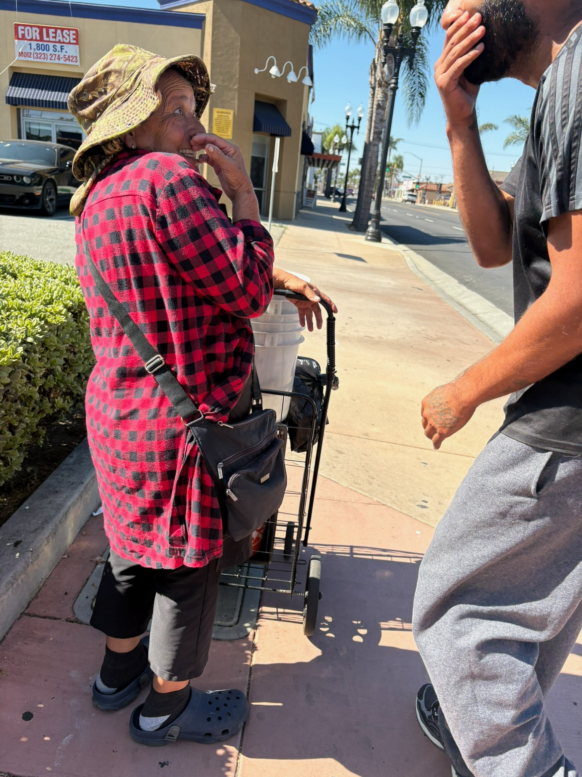 Volunteers Offering Aid to an Elderly Woman