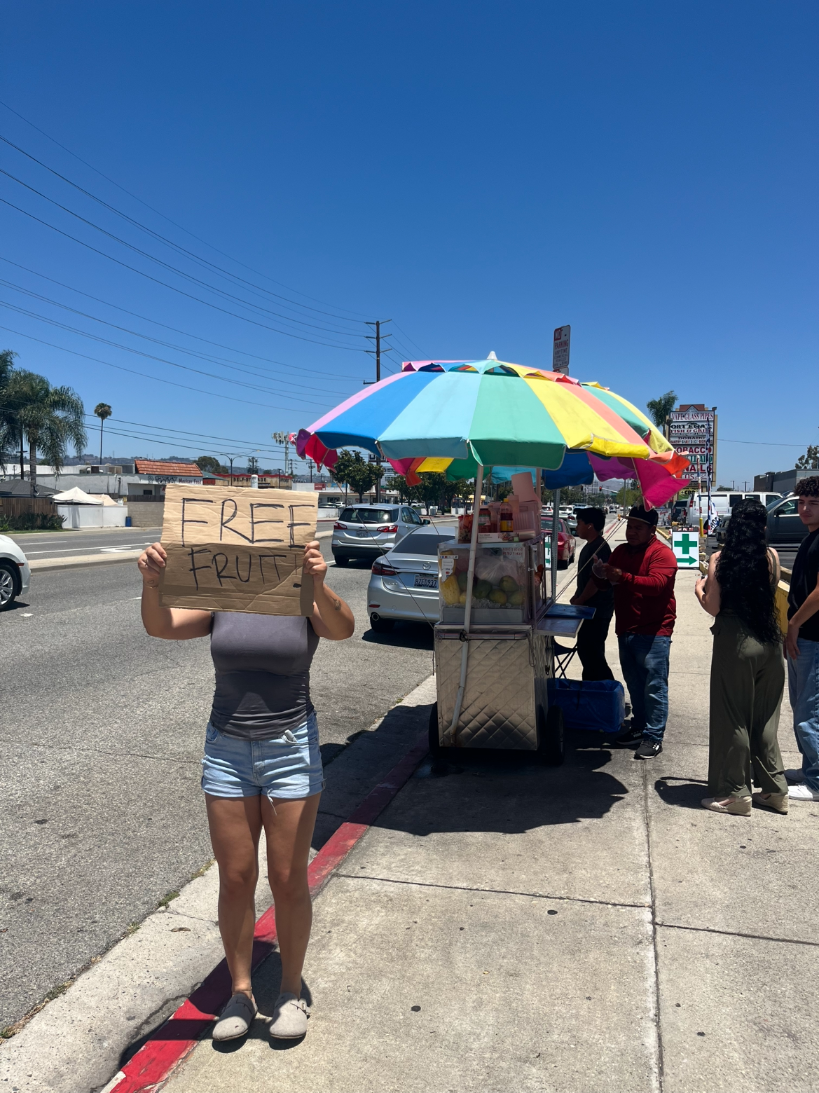 Volunteers Offering Free Fruit From a Bought Out Fruit Cart