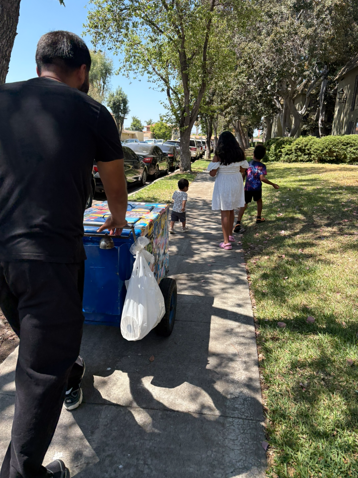 Volunteers Handing Out Ice Cream Bought From a Street Vendor