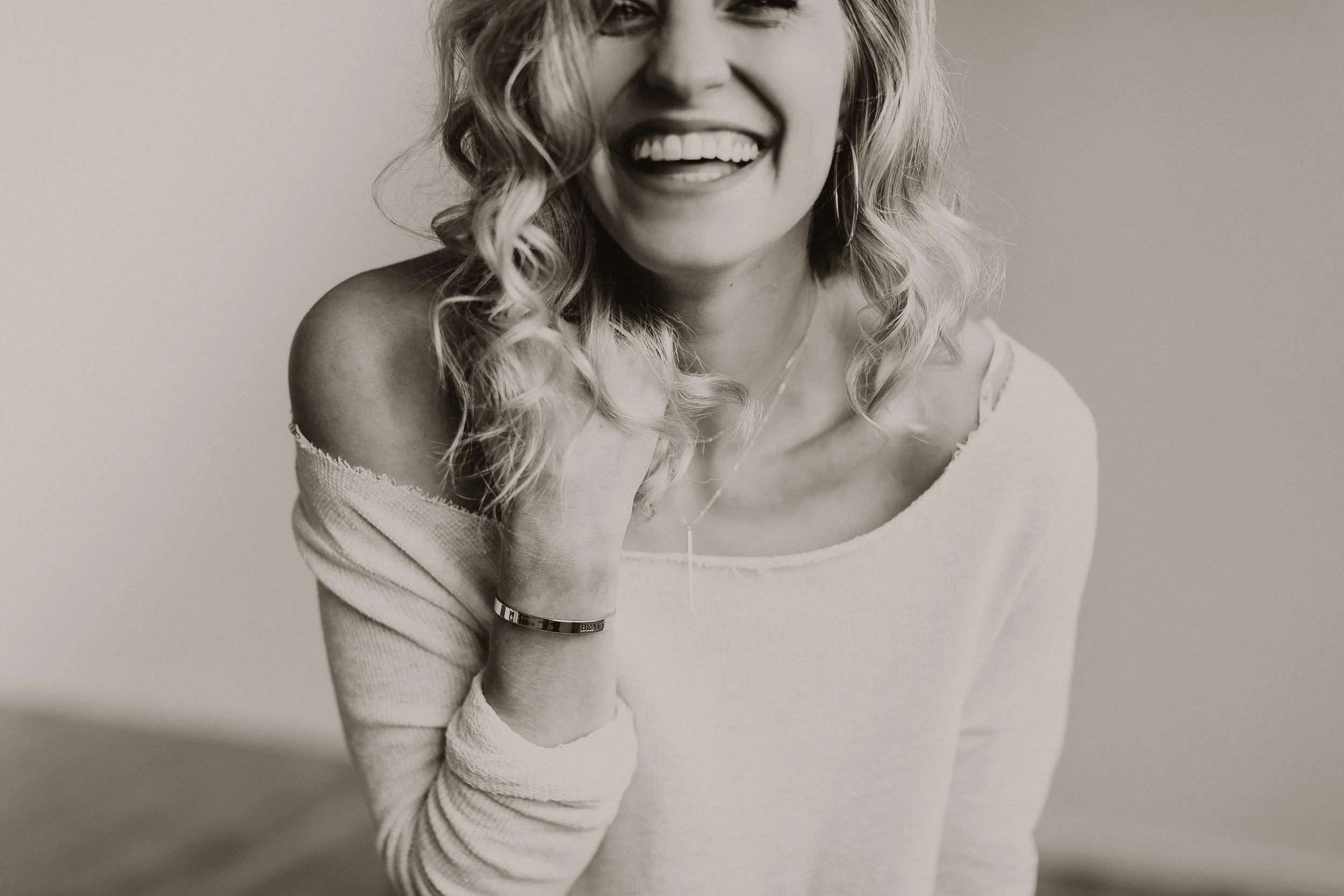 This is a candid, joyful photograph of Christina Erickson, the photographer behind Steena Anne Photography.