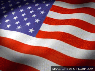 Close-up of the waving American flag with stars and stripes.